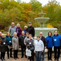 full group picture in front of the fountain